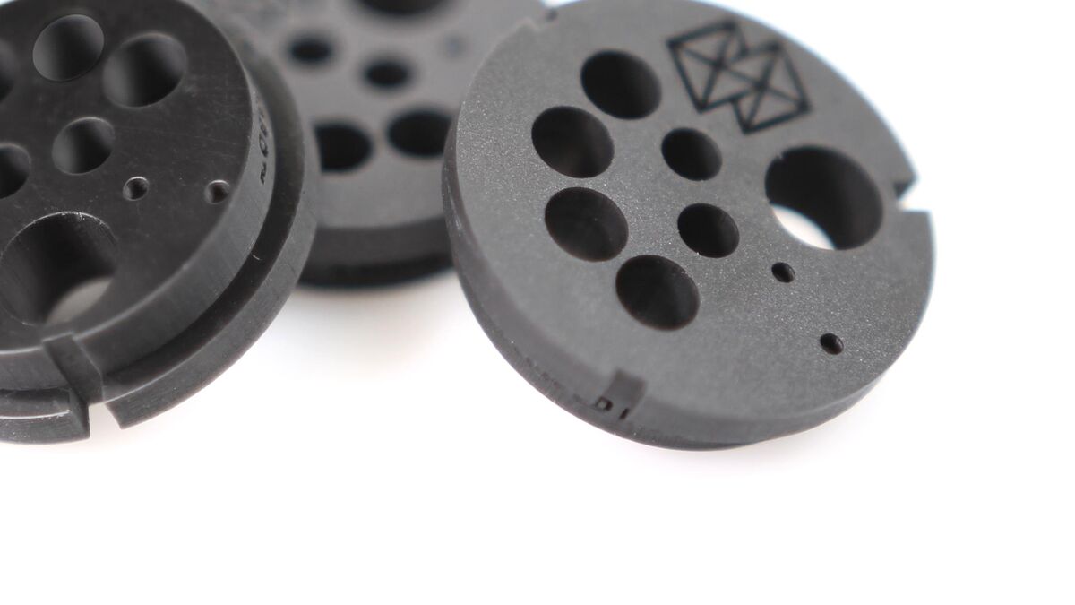Black ESD-safe electrical connector cores 3D printed on a Stratasys Origin One P3 DLP printer