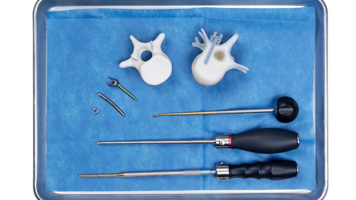 Surgical tray with 3D printed vertebra models and patient-specific guides from a Stratasys J5 Digital Anatomy printer