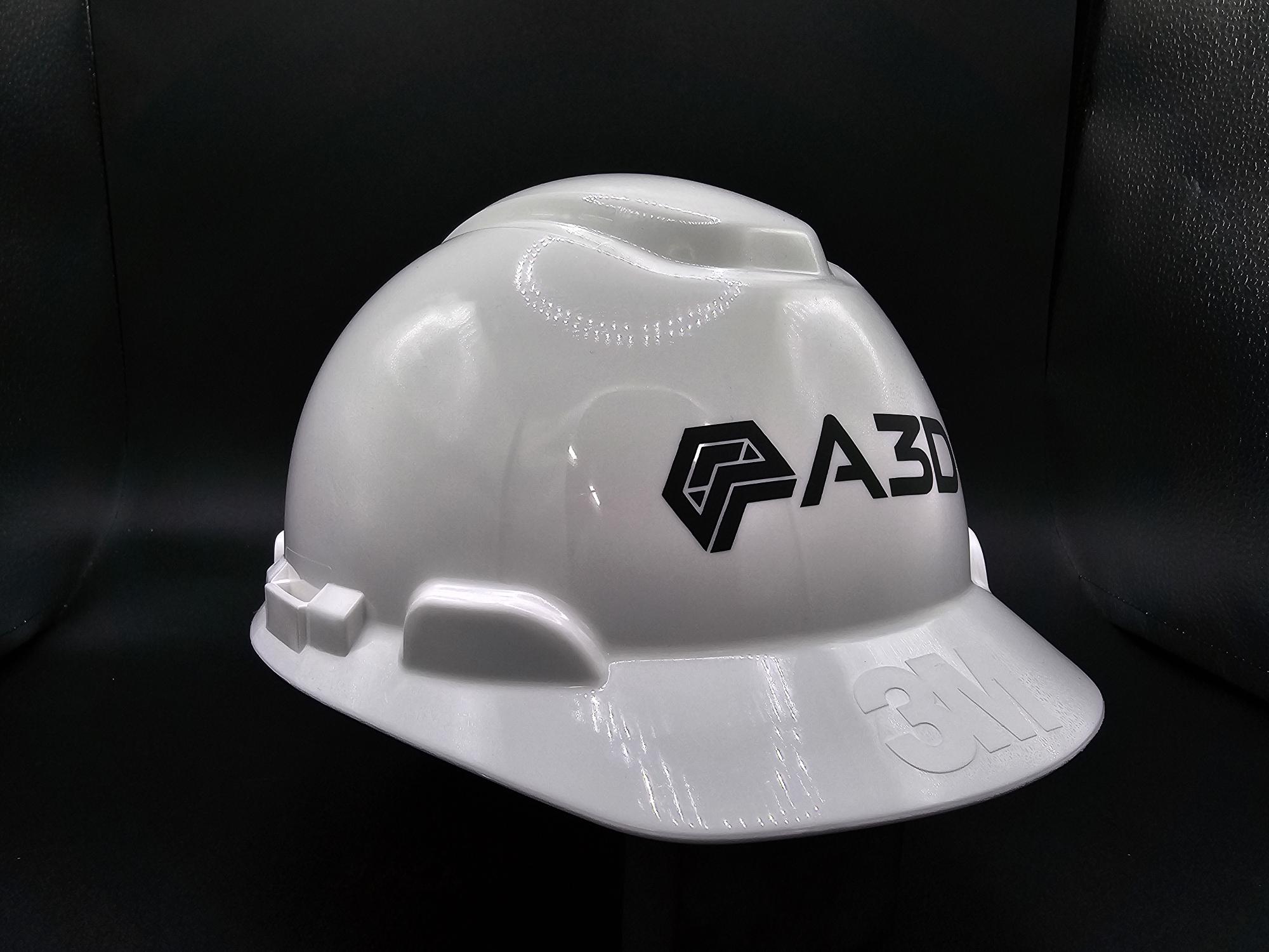 White 3D printed hard hat with the A3D Manufacturing logo