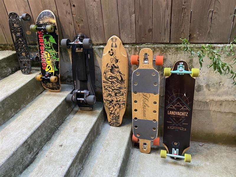 Collection of Skateboards including the first carbon-fiber nylon shortboard on the left.