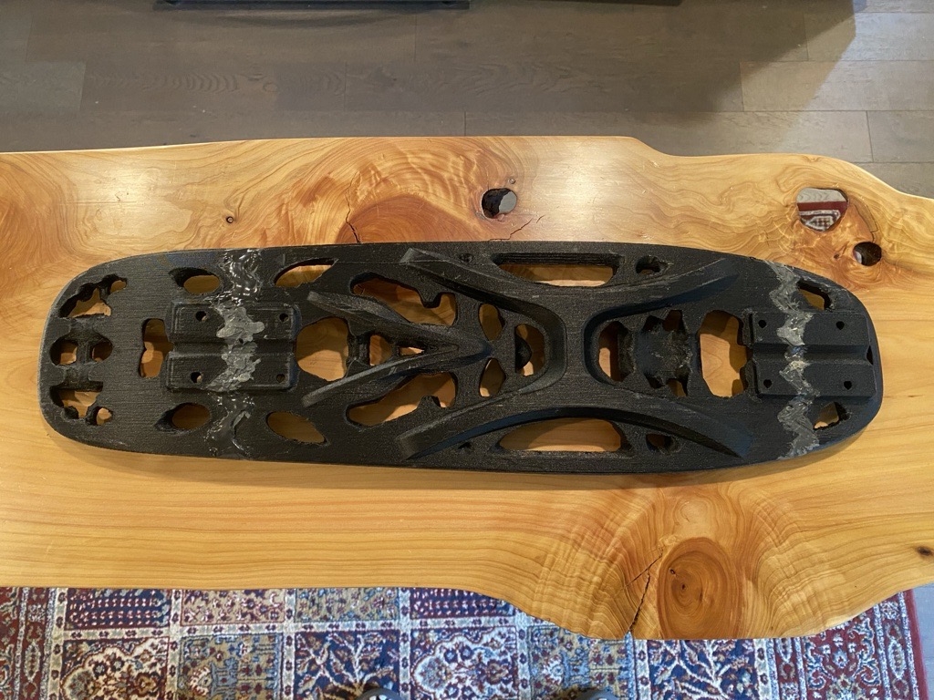 The 2019 SOLIDWORKS Topology Optimization Board, 3D printed in carbon-fiber nylon.
