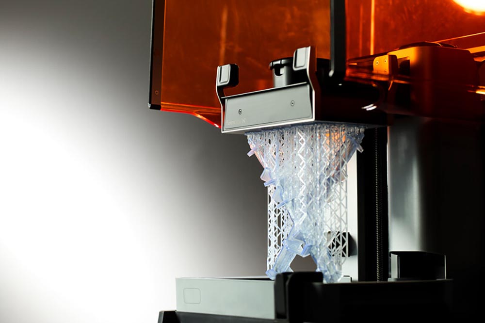 A part being printed using the Formlabs SLA print process 