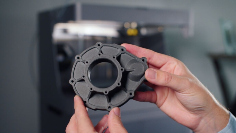 person holding a 3d printed part