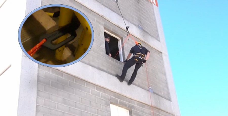 A person rappelling down the side of a building on a rope anchored by the carbon-fiber 3D printed lightning hook, with an inset close-up of the printed hook under load.