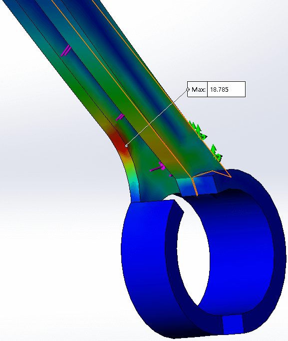 A SOLIDWORKS Simulation stress plot of the 3D printed catapult arm, with a rainbow von Mises color map and a peak stress callout of 18.785 at the round-to-flat transition.