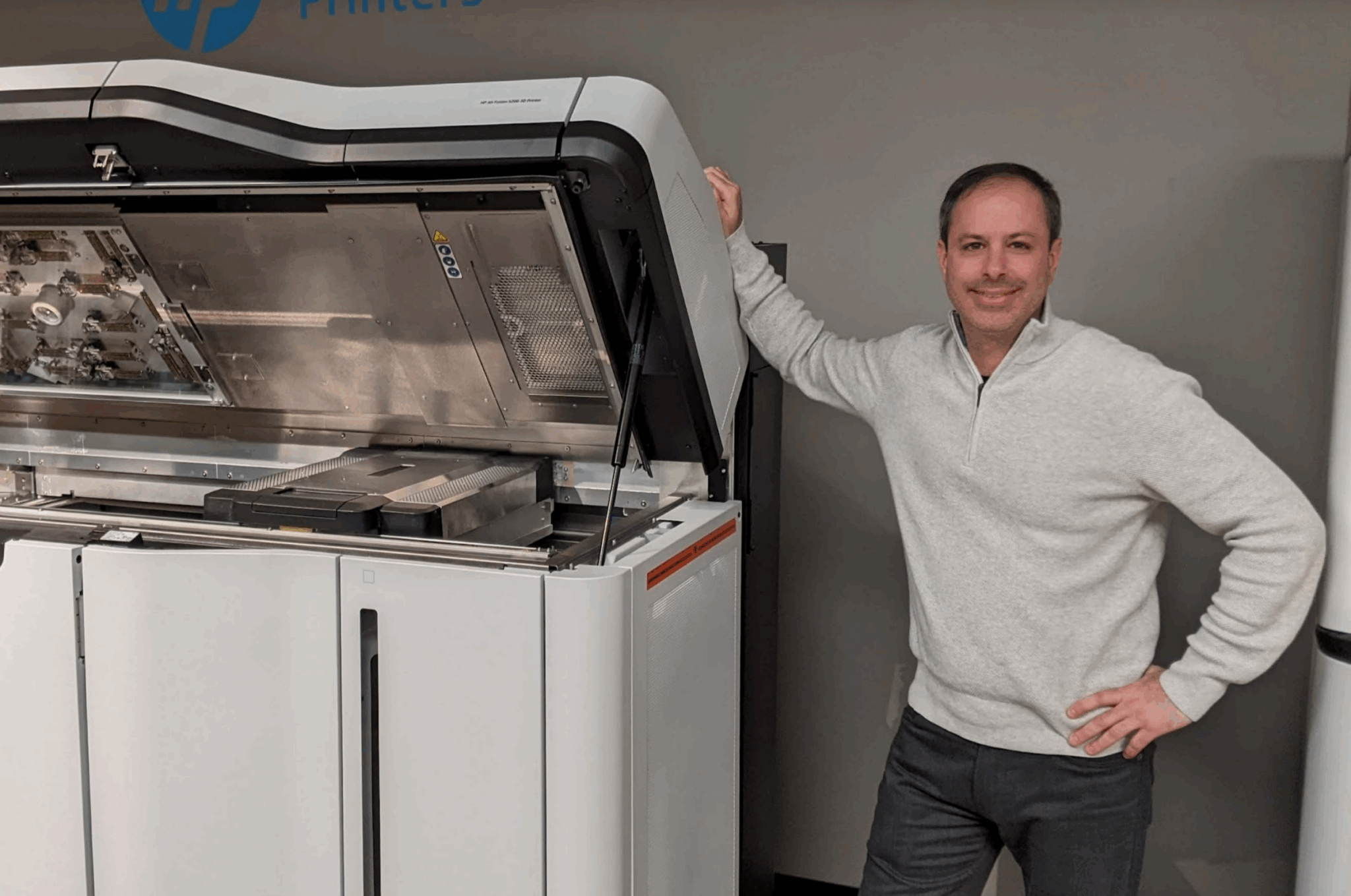 Andrew Garchik next to the HP MJF