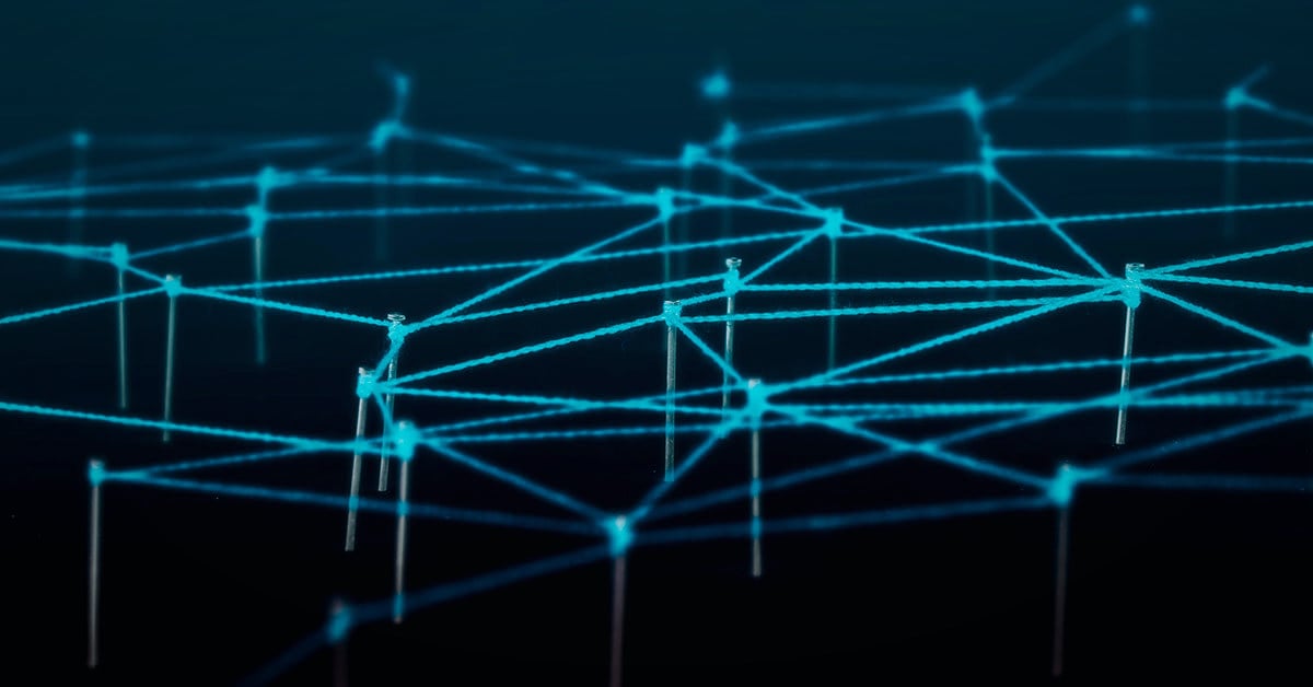 Cyan three-dimensional node lattice on a navy background, suggesting a connected platform