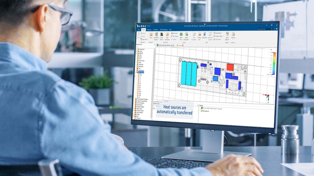 Engineer viewing CST thermal simulation results on a PCB model