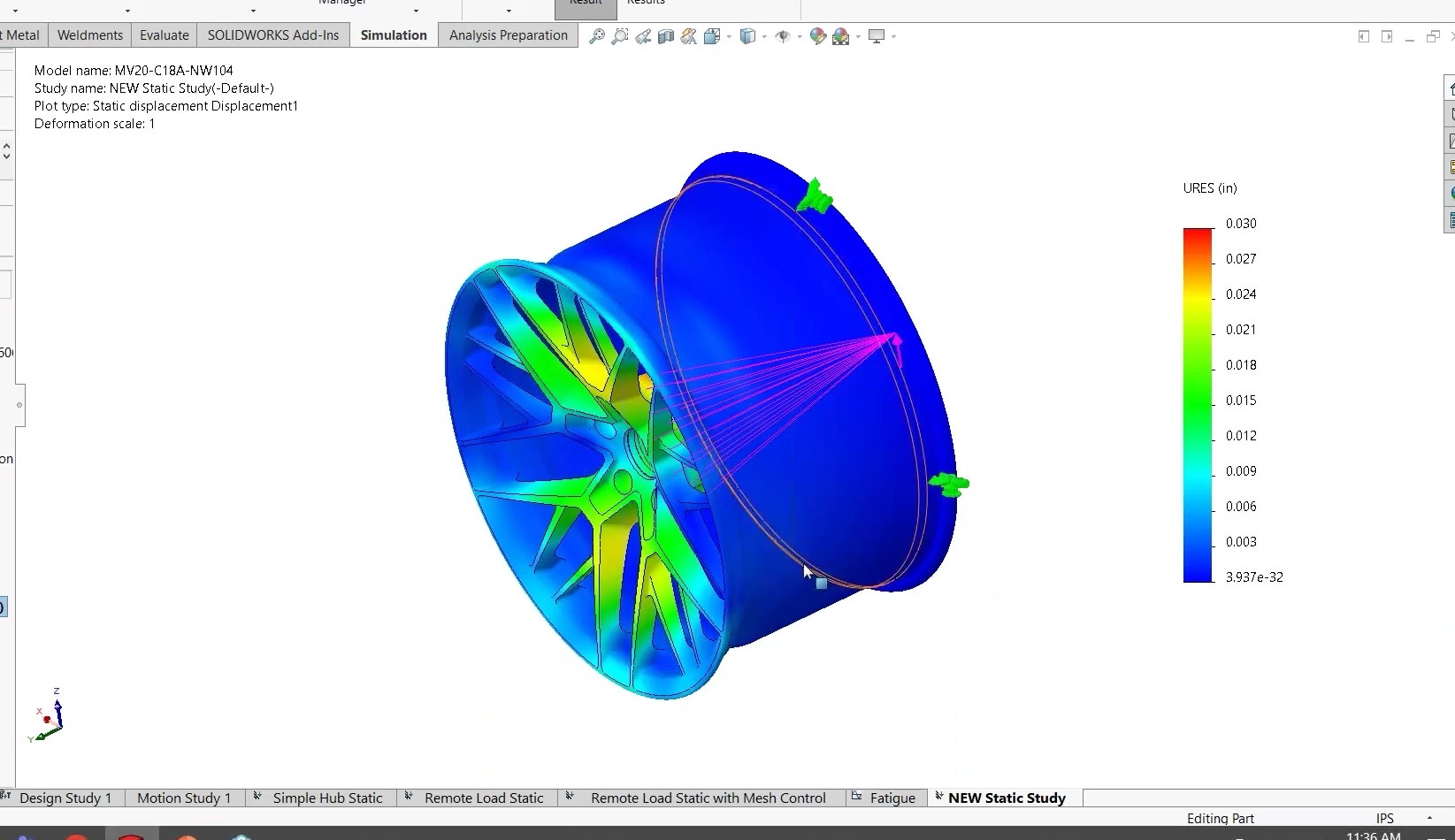 Close-up of the Forgeline NW104 wheel spokes in SOLIDWORKS Simulation showing a green-to-yellow displacement hotspot near the hub — the wheel’s most-deflected region under the cornering-fatigue load.