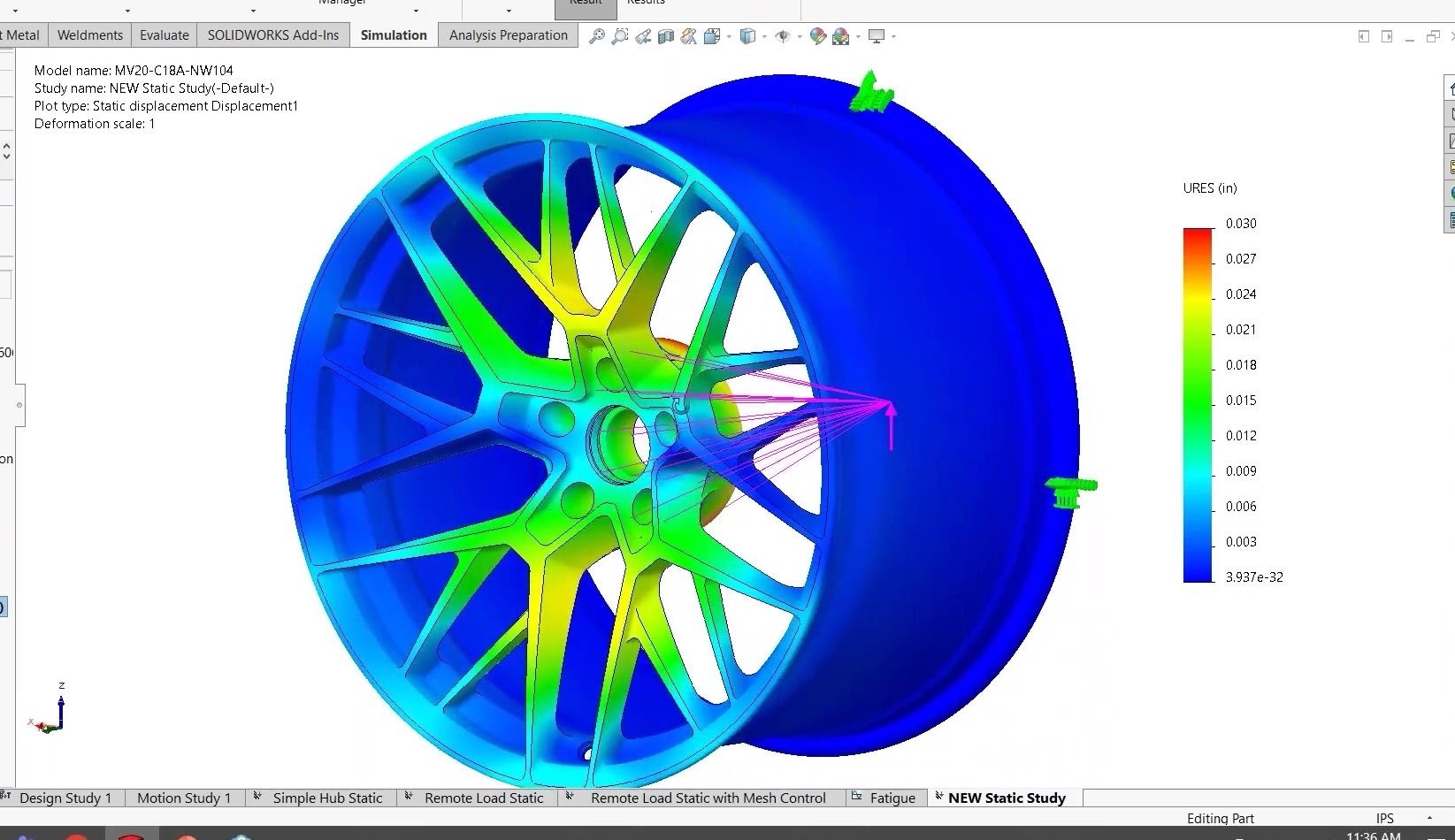 Three-quarter view of the NW104 wheel’s SOLIDWORKS Simulation displacement result, with the rim nearly undeformed in blue and the highest resultant displacement concentrated on the spokes.