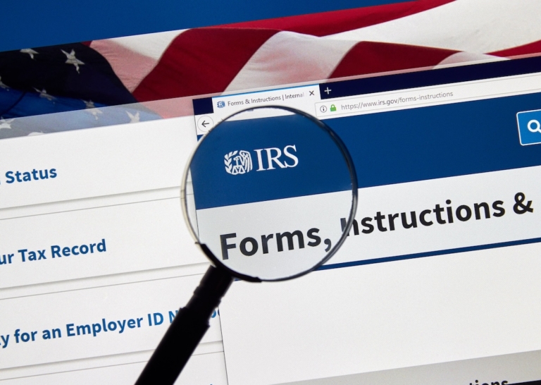 IRS Forms and Instructions USA Government home page under magnifying glass