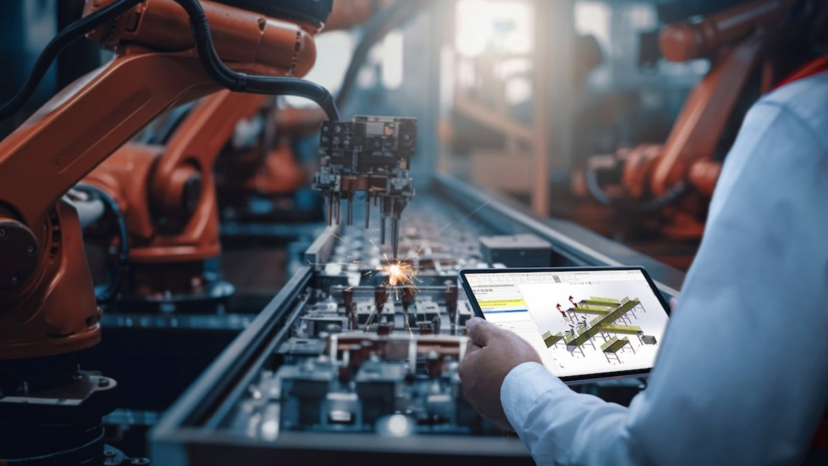 Engineers test the control of a robotic arm