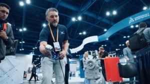 HRS employee showcasing 3D scanners at a conference