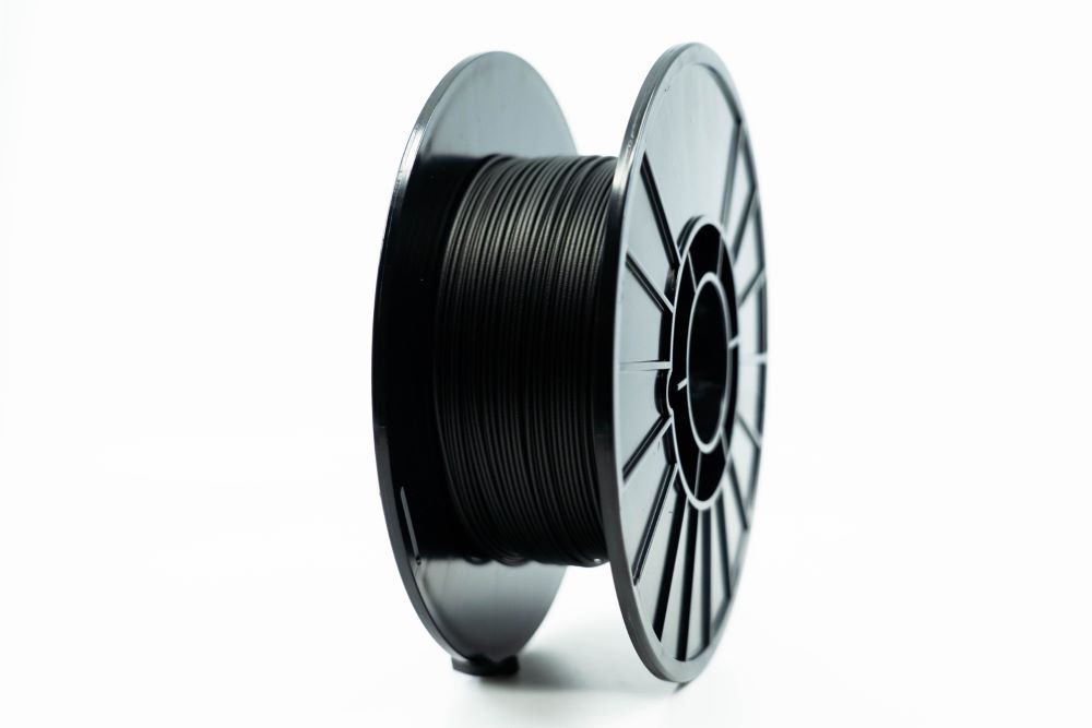 A black Markforged filament spool