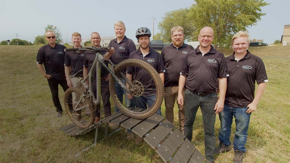 Pezo Solutions Team with One of Their Designs of a Bike Ramp