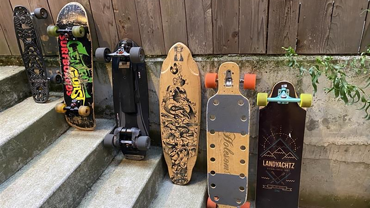 Collection of Skateboards including the first carbon-fiber nylon shortboard on the left.